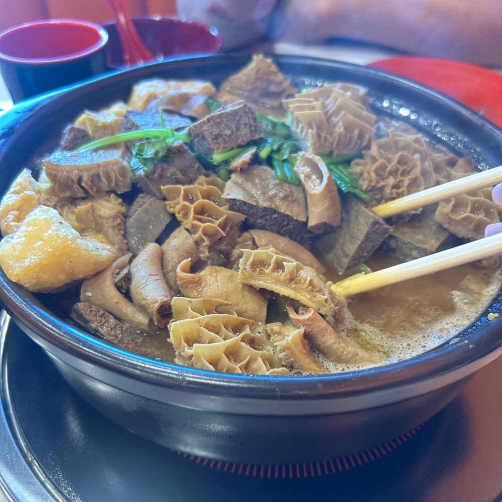 A hot pot with beef tripe and other ingredients at GWONGFU BEEF MIX INC, a Chinese Restaurant in Brooklyn