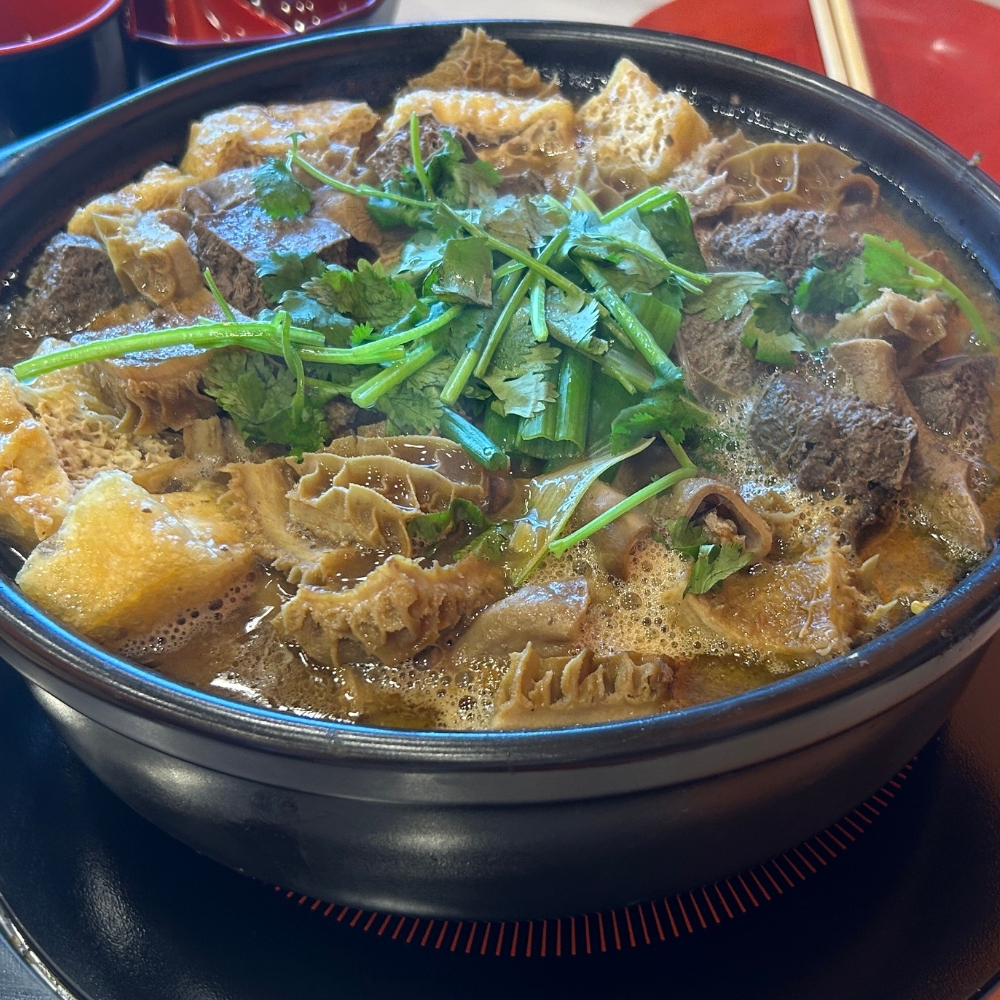 A hot pot with beef tripe and other ingredients at GWONGFU BEEF MIX INC, a Chinese Restaurant in Brooklyn