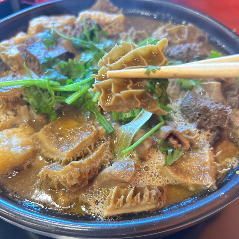 A hot pot with beef tripe and other ingredients at GWONGFU BEEF MIX INC, a Chinese Restaurant in Brooklyn