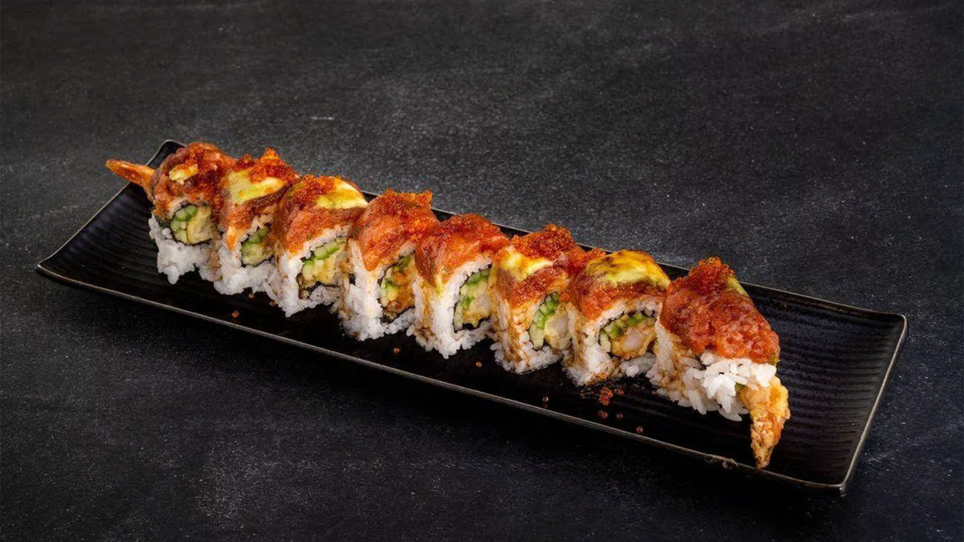 Sushi roll with tempura, cucumber, and spicy topping at Haha Ramen Sushi, a Japanese restaurant in Hayward