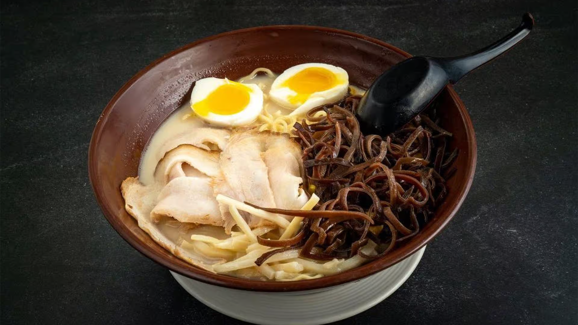 Creamy tonkotsu ramen with eggs, pork, and black fungus at Haha Ramen Sushi, a Japanese restaurant in Hayward