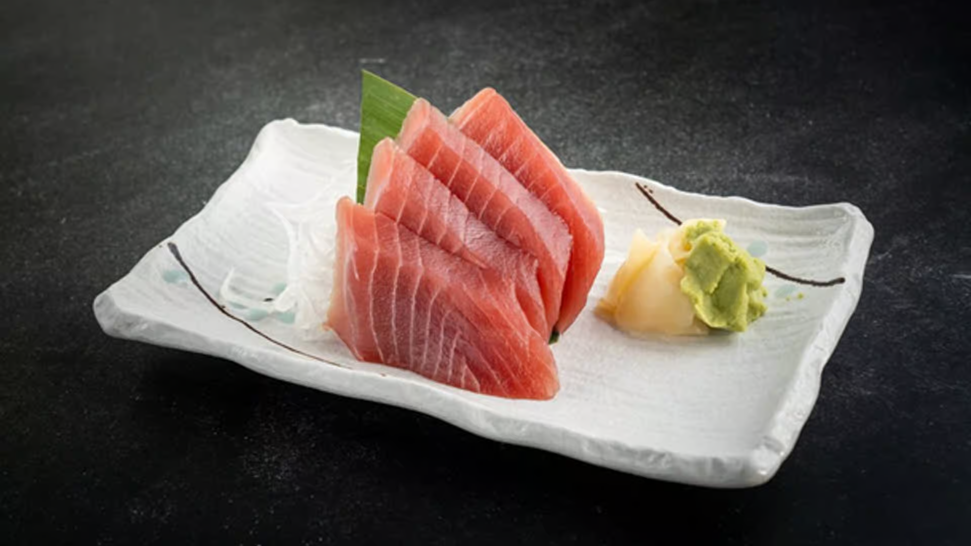 Fresh tuna sashimi with wasabi and pickled ginger at Haha Ramen Sushi, a Japanese restaurant in Hayward