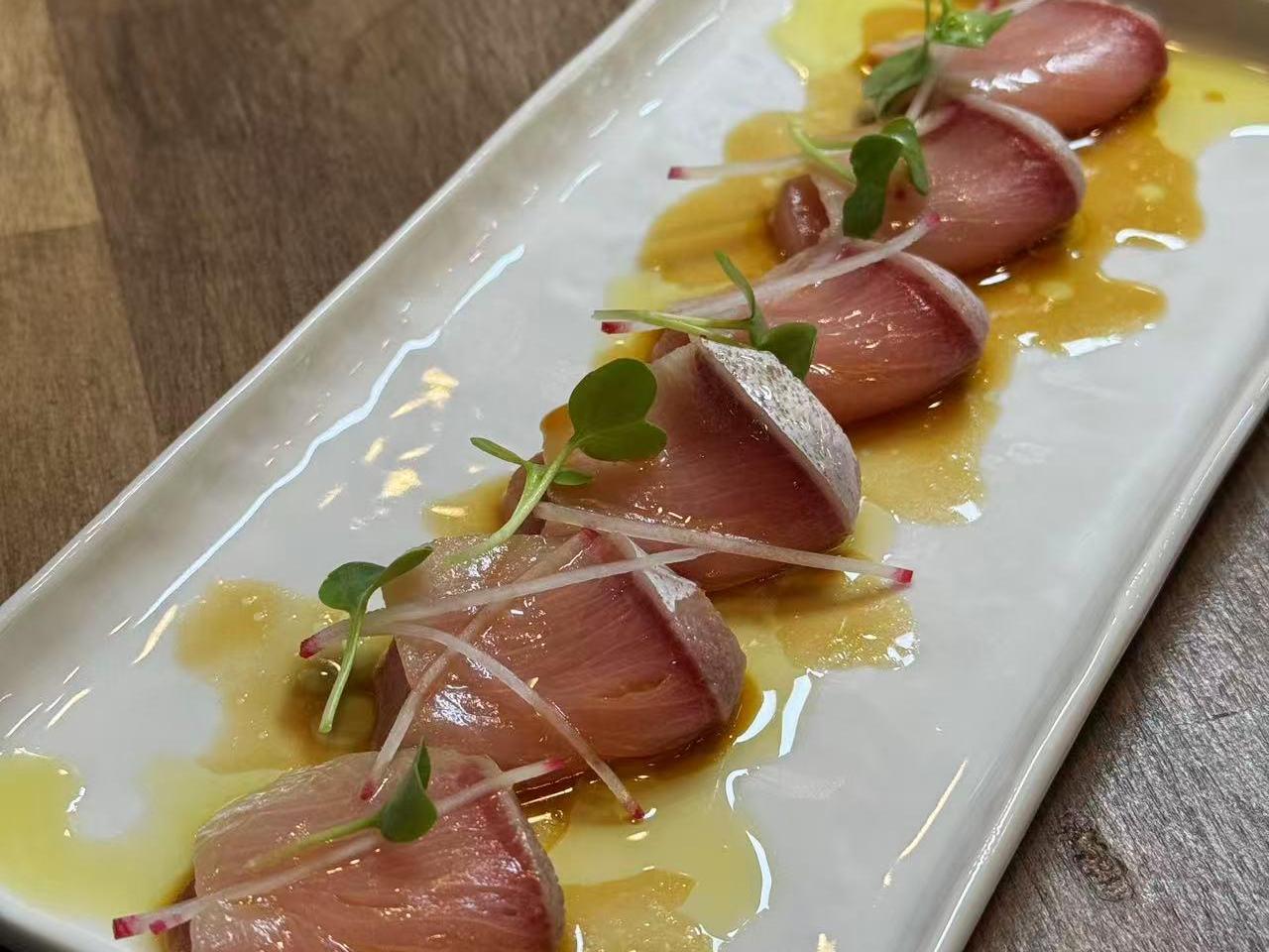 Hamachi carpaccio with microgreens at Hakkai Nigiri Bar & Tapas, a Japanese Restaurant in San Carlo