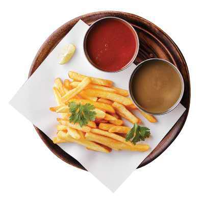 Golden fries with ketchup, brown sauce, lemon, and parsley garnish at Cherry Amber, a Asian fusion restaurant in Plainview