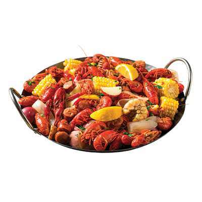 Crawfish boil with red crawfish, corn, potatoes, sausage, and lemon wedges at Cherry Amber, a Asian fusion restaurant in Plainview