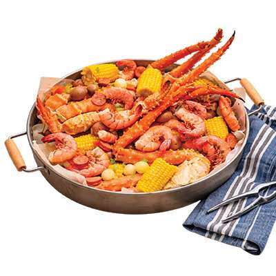 Seafood boil platter with king crab legs, shrimp, corn, and potatoes at Cherry Amber, a Asian fusion restaurant in Plainview