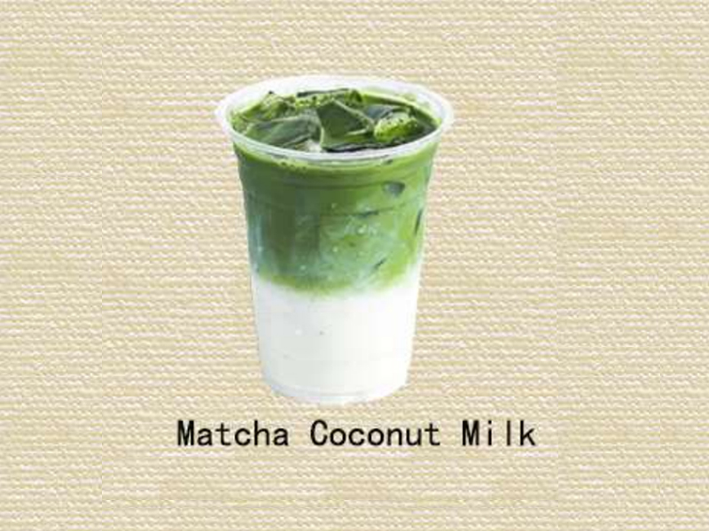 Layered iced matcha coconut milk latte with smooth texture at Hannie Bite, an Asian Restaurant in Philadelphia