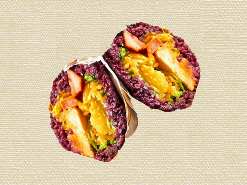 Savory purple rice burrito stuffed with crispy chicken at Hannie Bite, an Asian Restaurant in Philadelphia