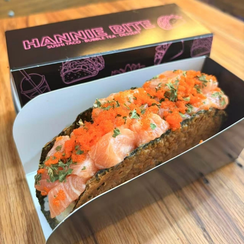 Fresh salmon sushi taco covered with plentiful fish roe at Hannie Bite, Asian Restaurant in Philadelphia