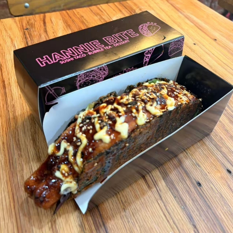 Glazed unagi sushi taco topped with white sesame seeds at Hannie Bite, Asian Restaurant in Philadelphia