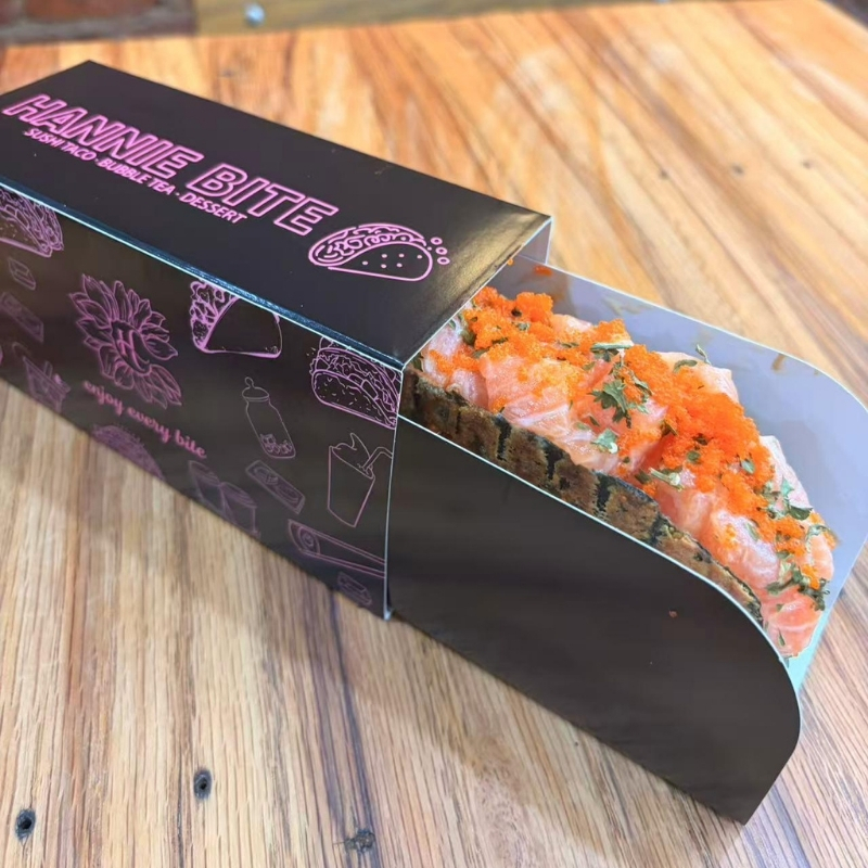 Salmon sushi taco sprinkled with bright orange roe at Hannie Bite, Asian Restaurant in Philadelphia