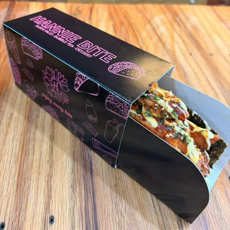Saucy grilled chicken sushi taco in brand packaging at Hannie Bite, Asian Restaurant in Philadelphia