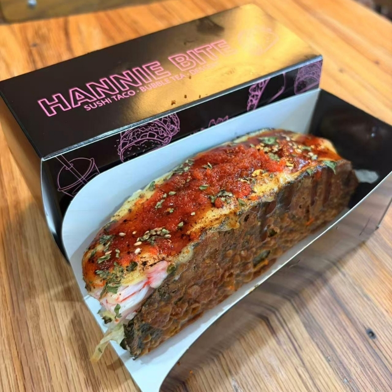 Spicy crab stick sushi taco with red sauce at Hannie Bite, Asian Restaurant in Philadelphia