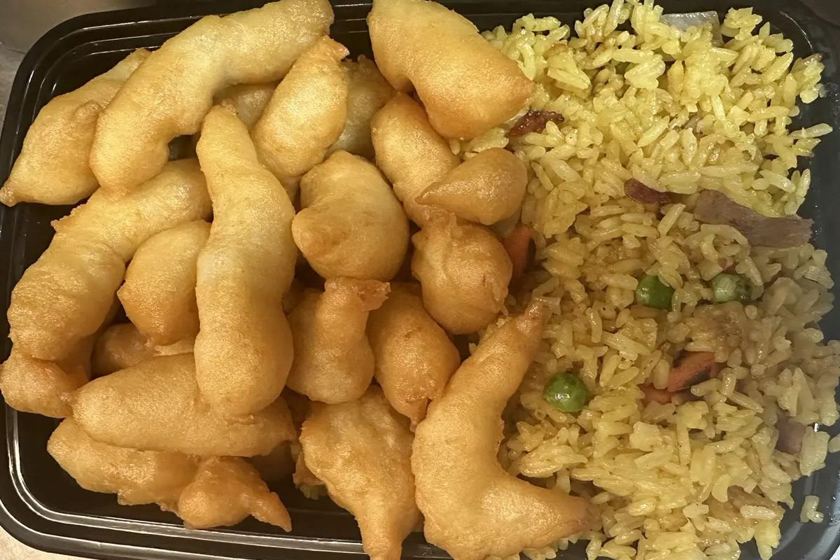 Fried cream cheese wontons paired with yellow fried rice at Happy China, a Chinese Restaurant in Martinez