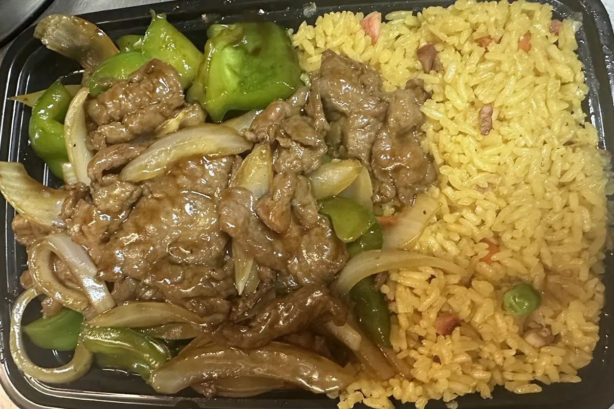 Sliced beef stir-fried with green peppers, onions and yellow fried rice at Happy China, a Chinese Restaurant in Martinez