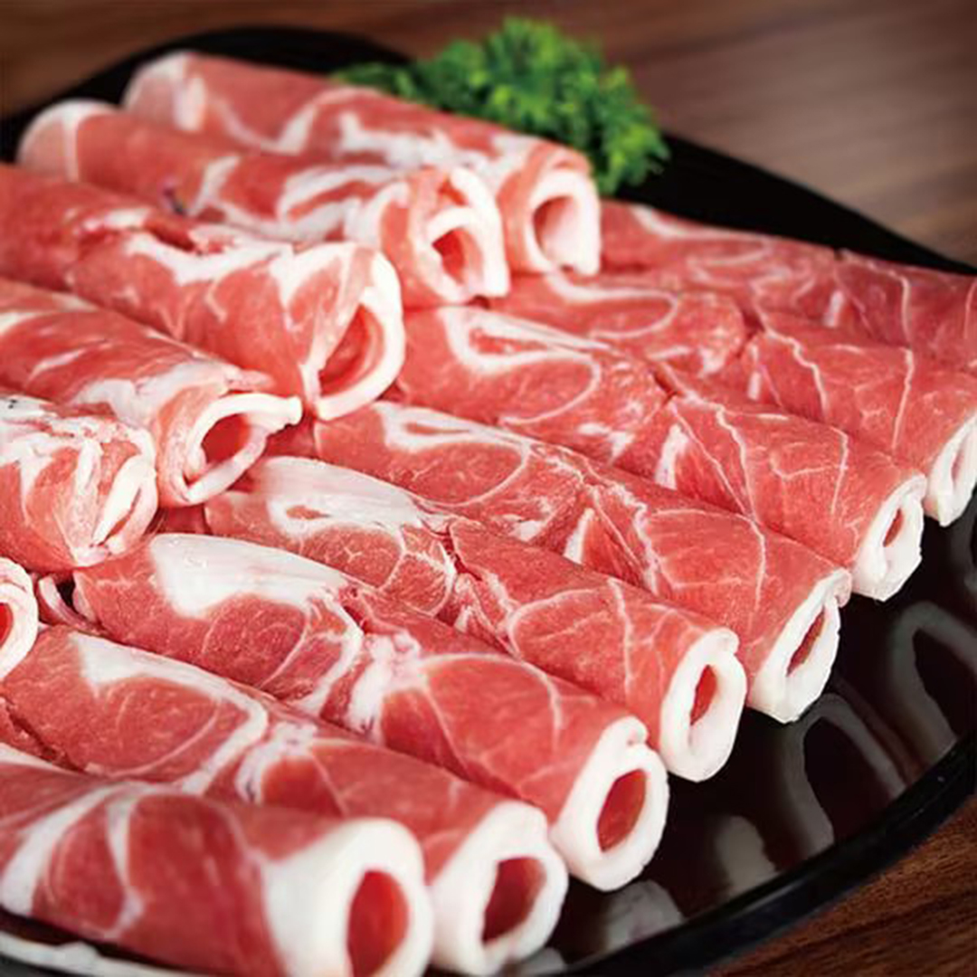 Rolls of fresh sliced mutton arranged on a plate at Happy Lamb Hot Pot Restaurant in Austin
