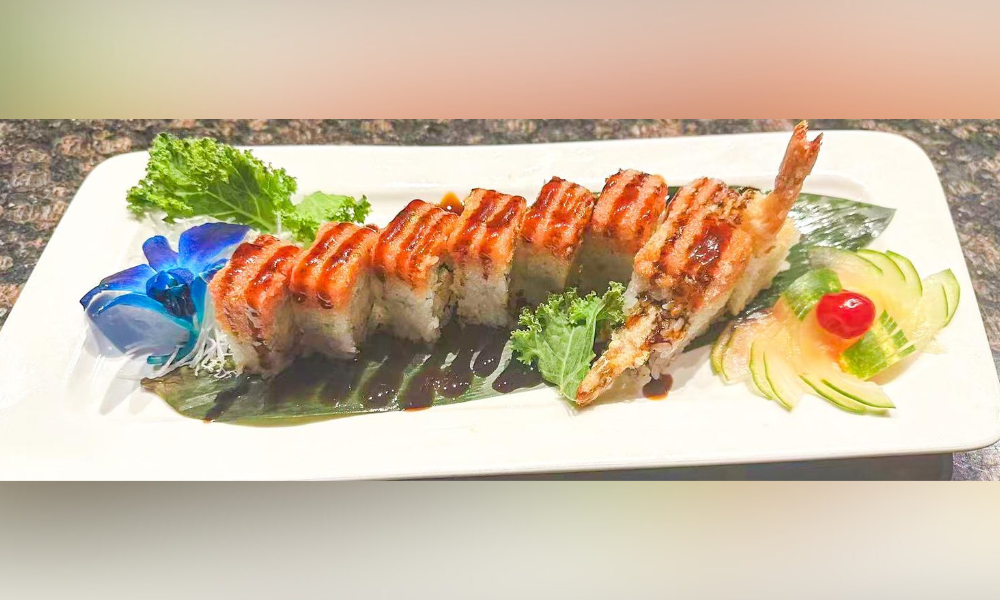 Sushi roll with shrimp tempura, garnished with sauce and greens at Haru Sushi, a Japanese restaurant in Williamsburg