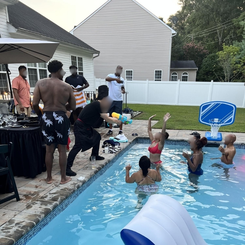Hibachi-At-Yours-Hibachi-Restaurant-Poolside-Hibachi-Fun-Columbia Chef interacts with guests in pool at Hibachi At Yours,a Hibachi Restaurant in Columbia.