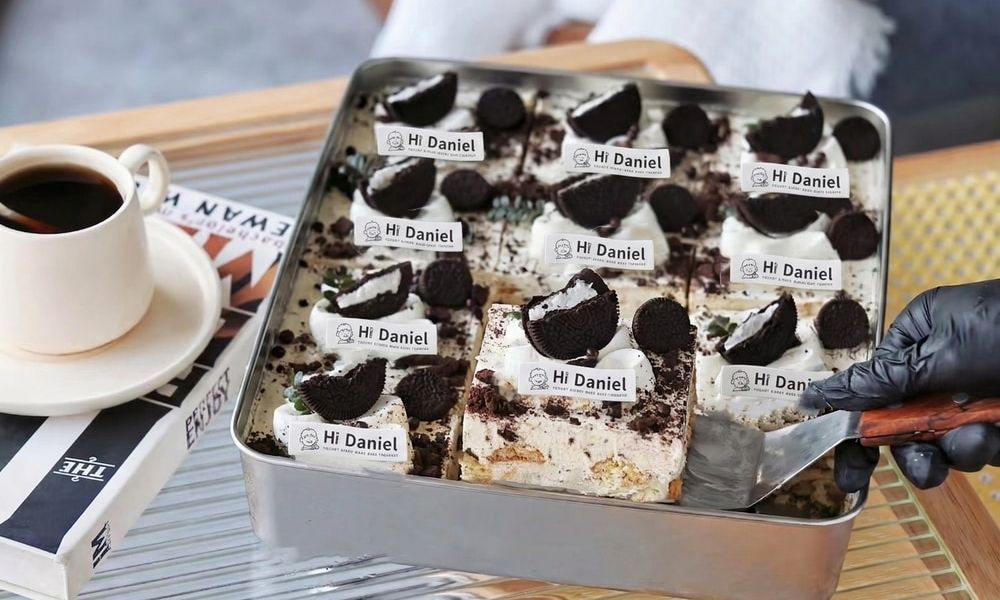 Hi Daniel Oreo Cake Creamy cake topped with crushed Oreos and whole cookies at Hi Daniel, a Dessert Shop restaurant in Tukwila