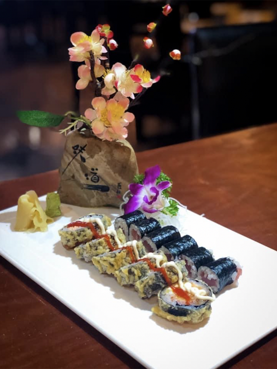 Tempura sushi roll with spicy sauce and wasabi at Hikari Sushi, a Japanese Restaurant in Jacksonville