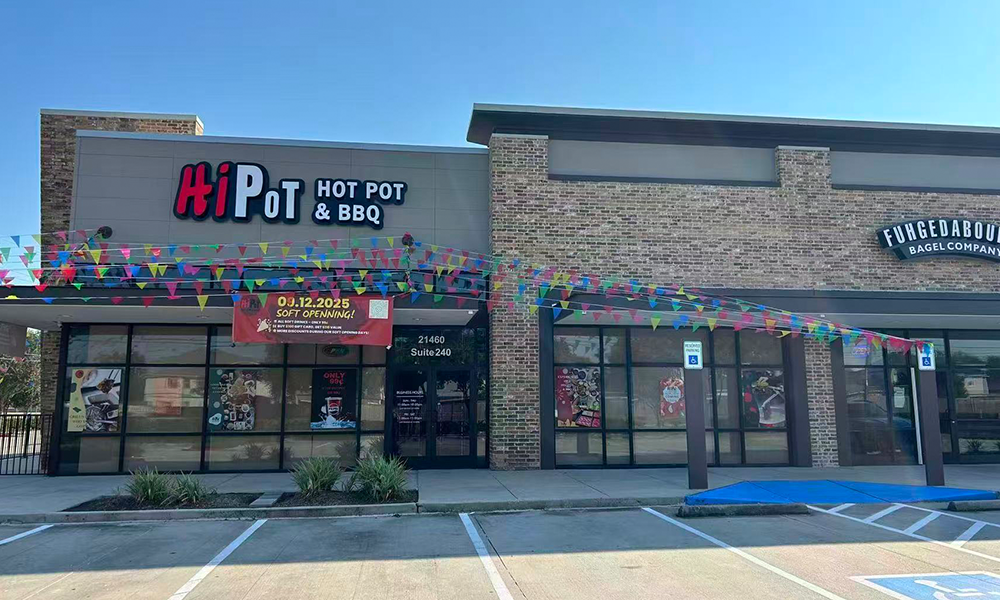 Bright exterior of Hi Pot Hot Pot & BBQ with grand opening decor at Hi Pot, a Hot Pot & Bbq Restaurant in Spring
