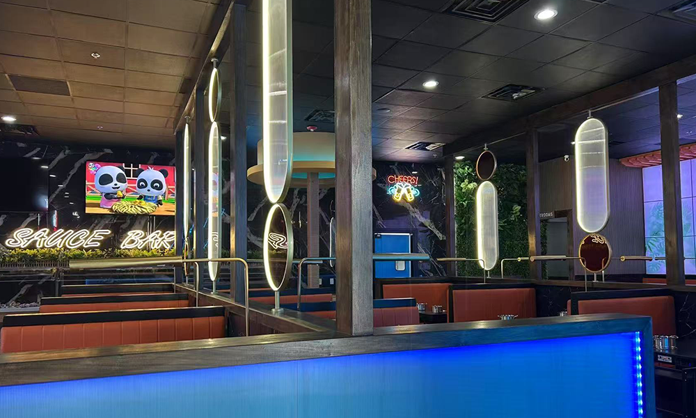 Stylish sauce bar & dining space with neon decor at Hi Pot, a Hot Pot & Bbq Restaurant in Spring