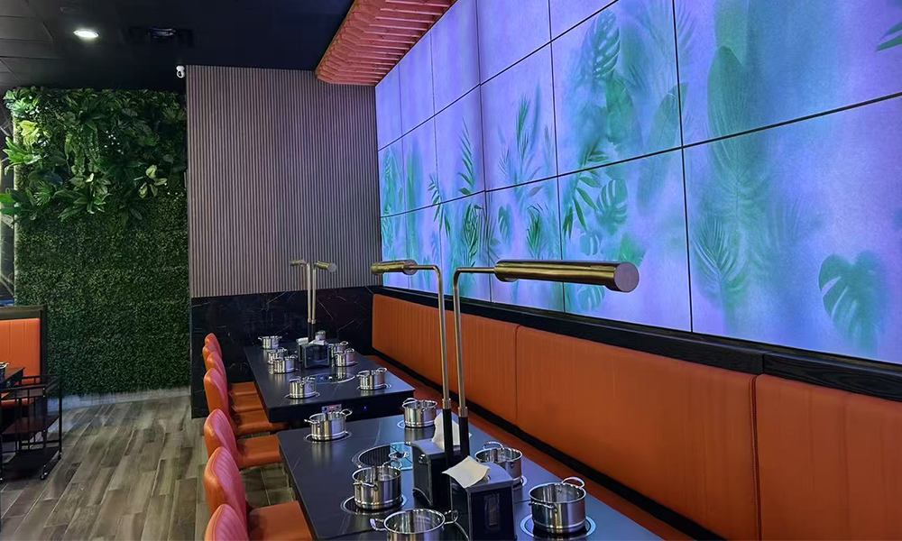 Tropical-themed hot pot dining area with lush decor at Hi Pot, a Hot Pot & Bbq Restaurant in Spring