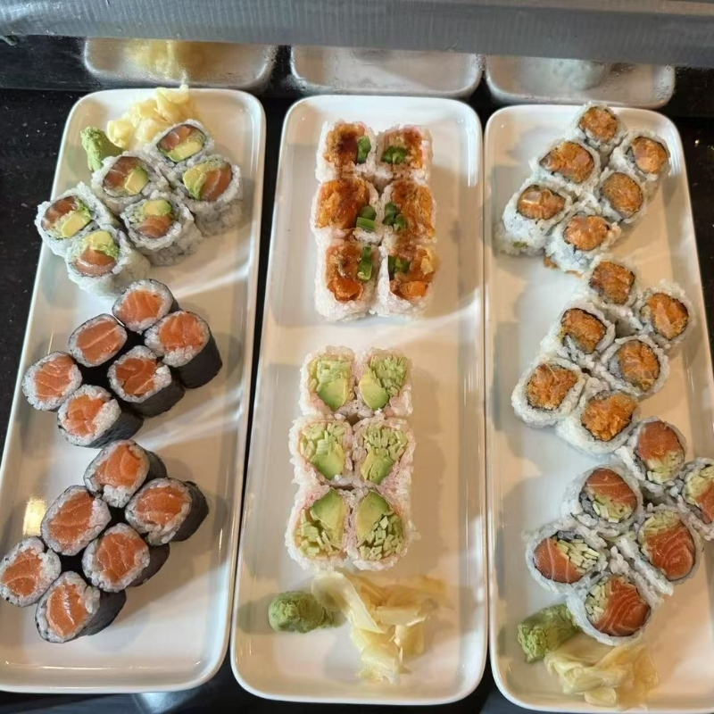 Hiromi-Sushi-Sushi-restaurant-Assorted-Sushi-Platters-New-York Various sushi rolls on white plates. At Hiromi Sushi,a Sushi Restaurant in New York,.