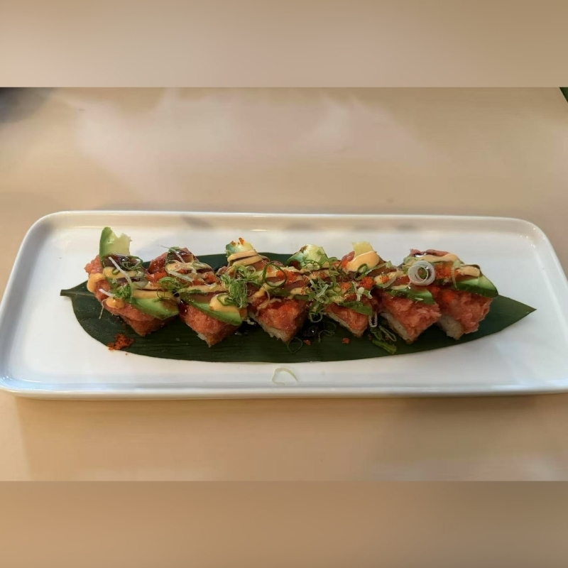 Hiromi-Sushi-Sushi-restaurant-Gourmet-Sushi-Bites-New-York Sushi pieces with toppings on a leaf. At Hiromi Sushi,a Sushi Restaurant in New York