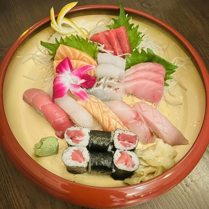 Hiromi-Sushi-Sushi-restaurant-Sashimi-Sushi-Platter-New-York Assorted sashimi and sushi on a golden plate. At Hiromi Sushi,a Sushi Restaurant in New York