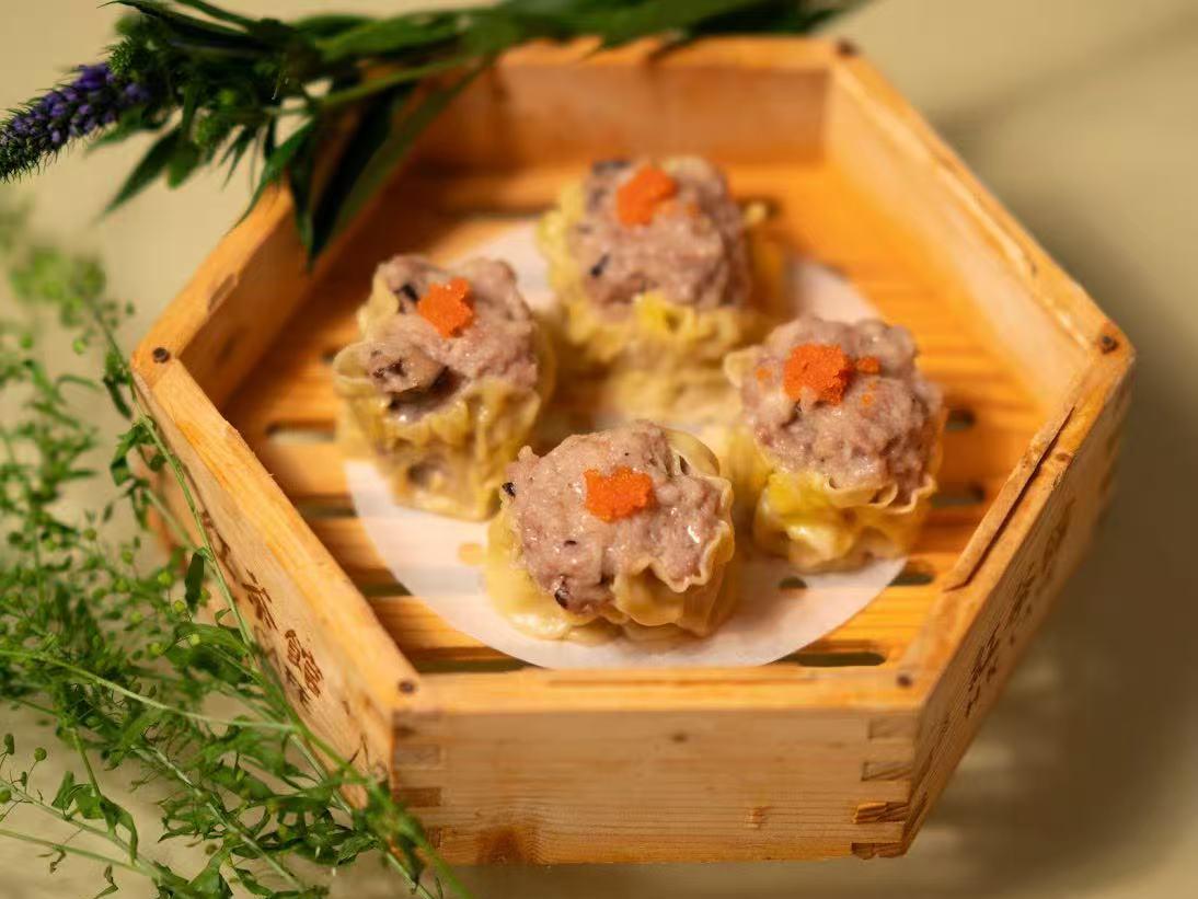 Shumai dumpling with meat and fish roe in bamboo steamer at HK Bistro, a Chines Hong Kong Restaurant in Portland