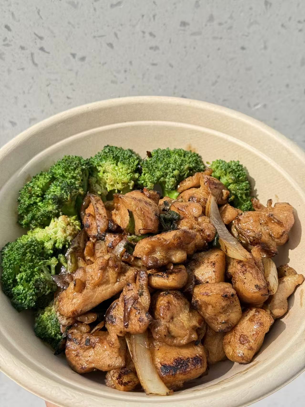 Wok - fired chicken with broccoli and onions at HK Bistro, a Chines Hong Kong Restaurant in Portland
