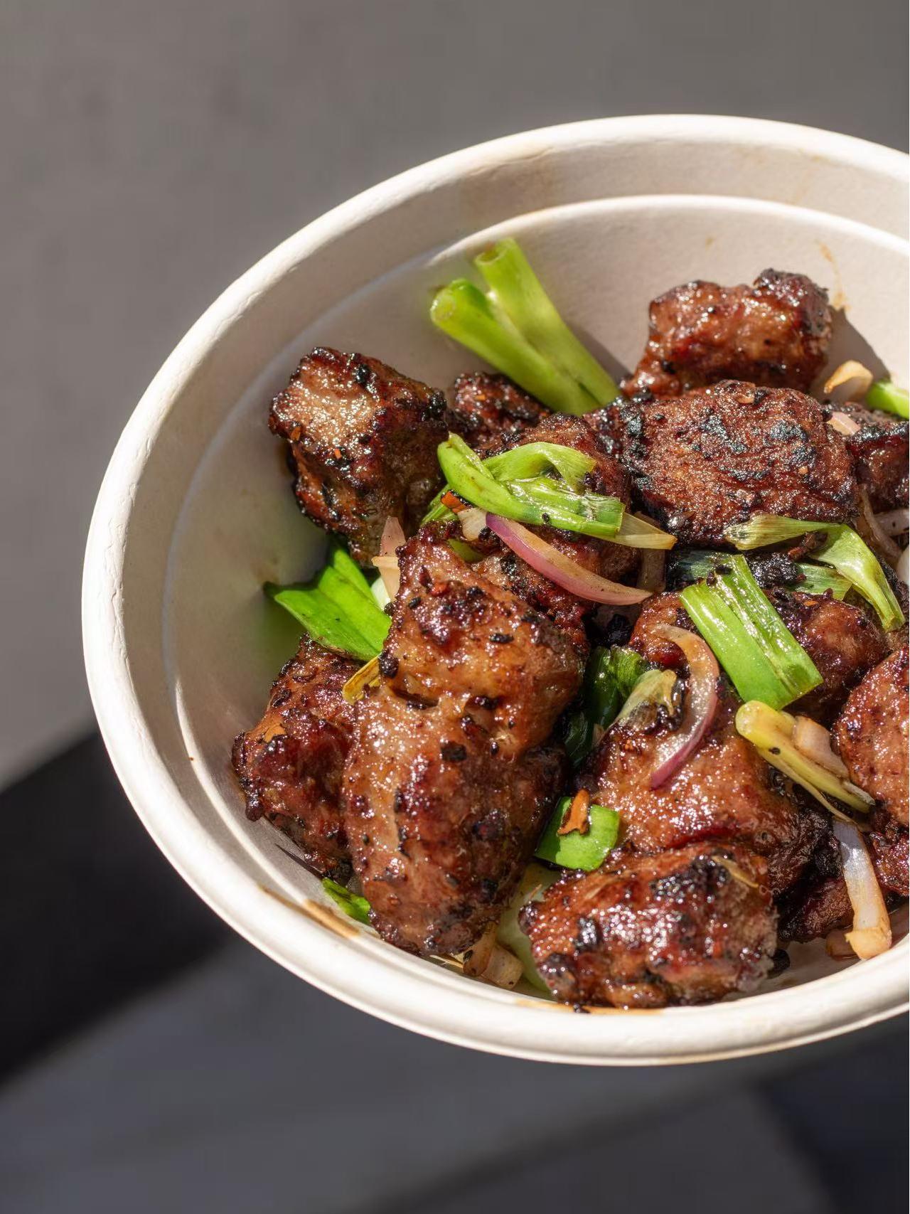Wok - seared steak with scallions and onions at HK Bistro, a Chines Hong Kong Restaurant in Portland