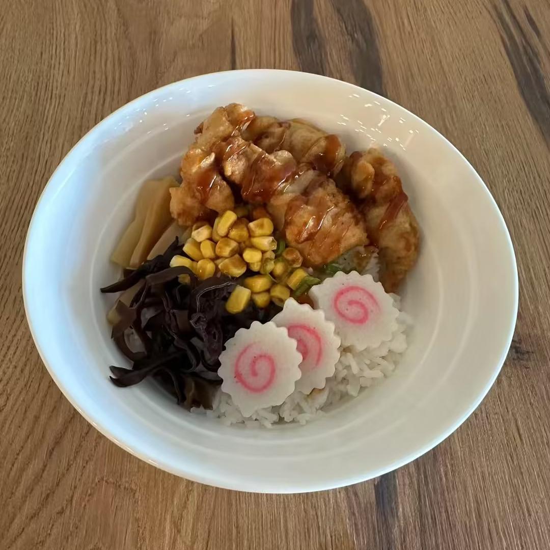 Hokkaido-Ramen-Japanese-restaurant-Chicken-Karrage-Don-Kill-Devil-Hills Chicken Karrage Don - Rice bowl with fried chicken, veggies, and corn at Hokkaido Ramen, a Japanese restaurant in Kill Devil Hills