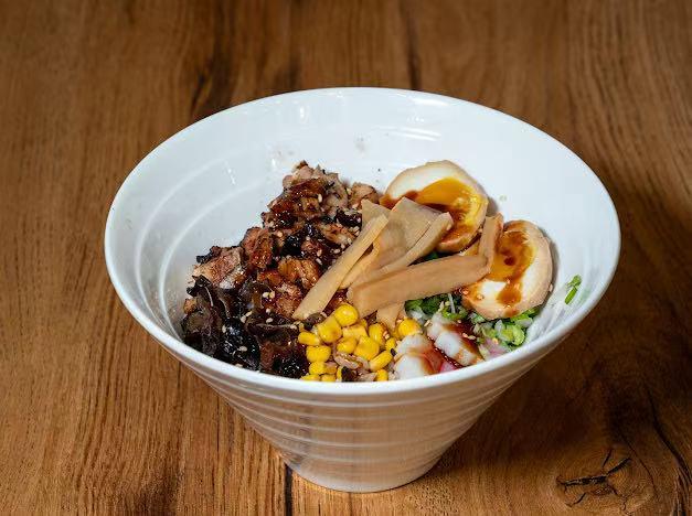 Rice bowl with chashu pork, egg and corn at Hokkaido Ramen, a Japanese restaurant in Kill Devil Hills