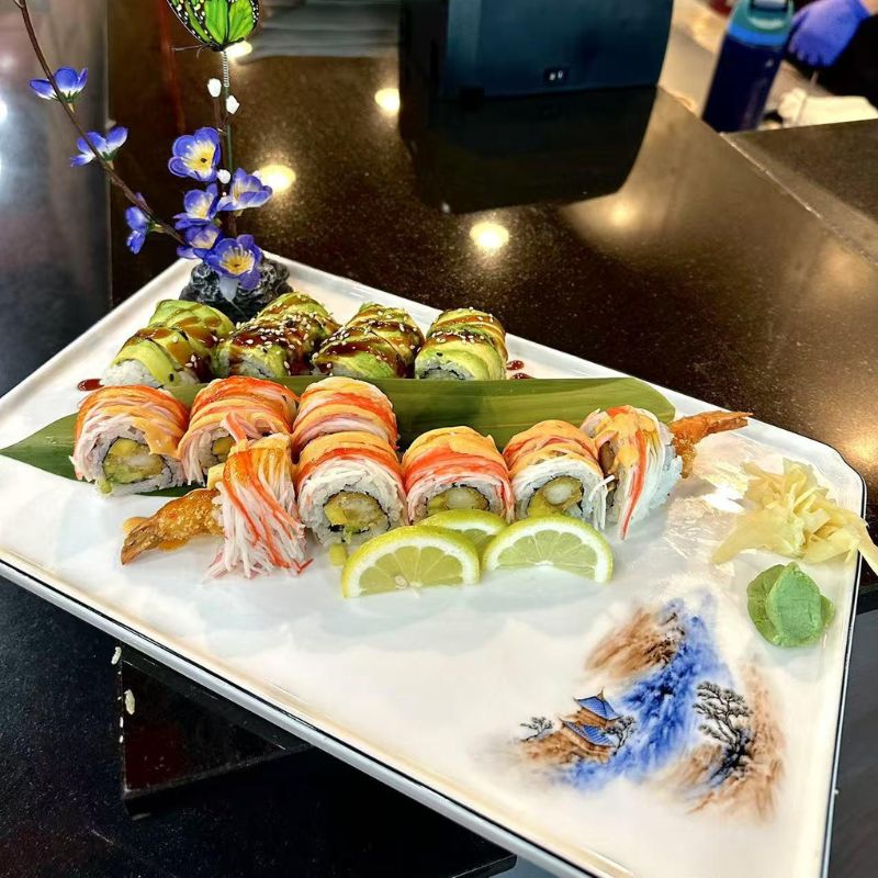 Hokkaido-Ramen-&-Sushi-Japanese-Restaurant-Colorful-Sushi-Rolls-Lubbock Colorful sushi rolls with shrimp tempura and avocado, attractively presented.