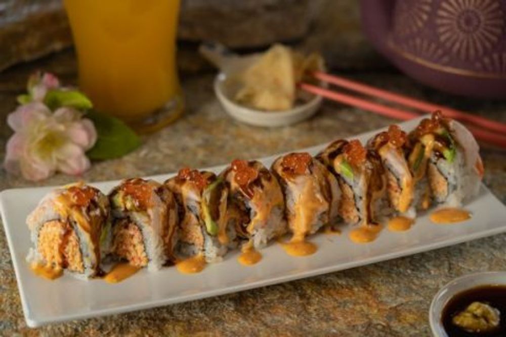 Premium seafood sushi roll topped with salmon roe and layered mixed fresh seafood at Hokkaido Sushi Bar, a Japanese Restaurant in Vancouver