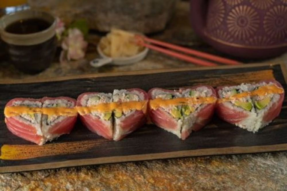 Heart-shaped tuna sushi rolls filled with avocado and creamy spicy sauce strip at Hokkaido Sushi Bar, a Japanese Restaurant in Vancouver