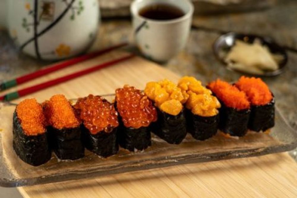 Nigiri sushi set with tobiko, salmon roe and creamy sea urchin toppings at Hokkaido Sushi Bar, a Japanese Restaurant in Vancouver