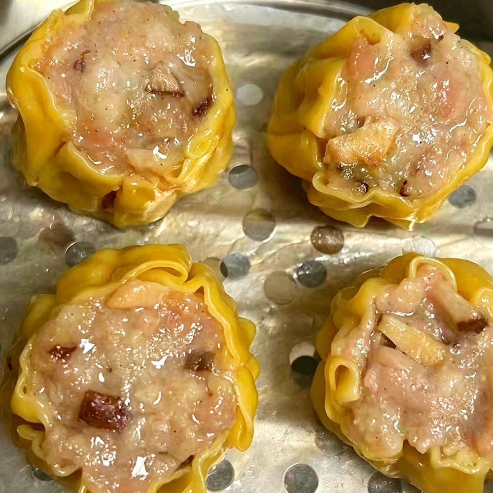 Juicy pork siu mai dumplings in bamboo steamer at Hongda Dough House, a Chinese Restaurant in North Plains