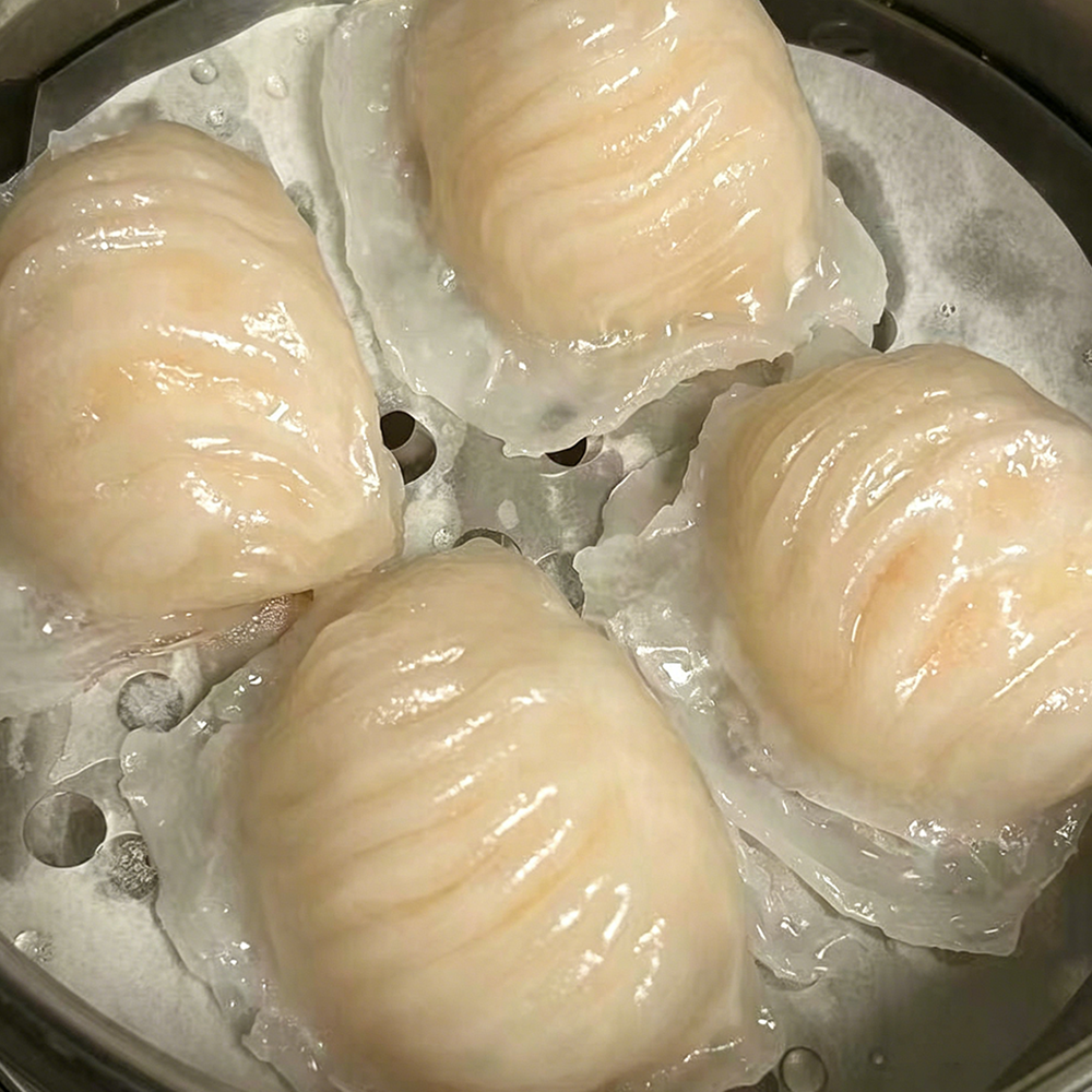 Steamed har gow shrimp dumplings in bamboo steamer at Hongda Dough House, a Chinese Restaurant in North Plains