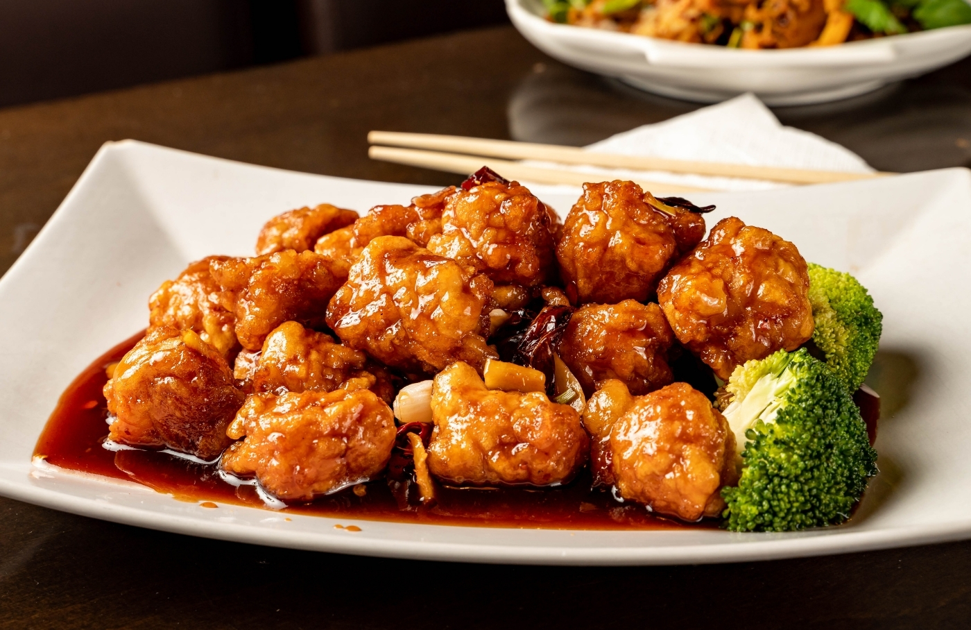 Crispy orange chicken with dried chili and broccoli