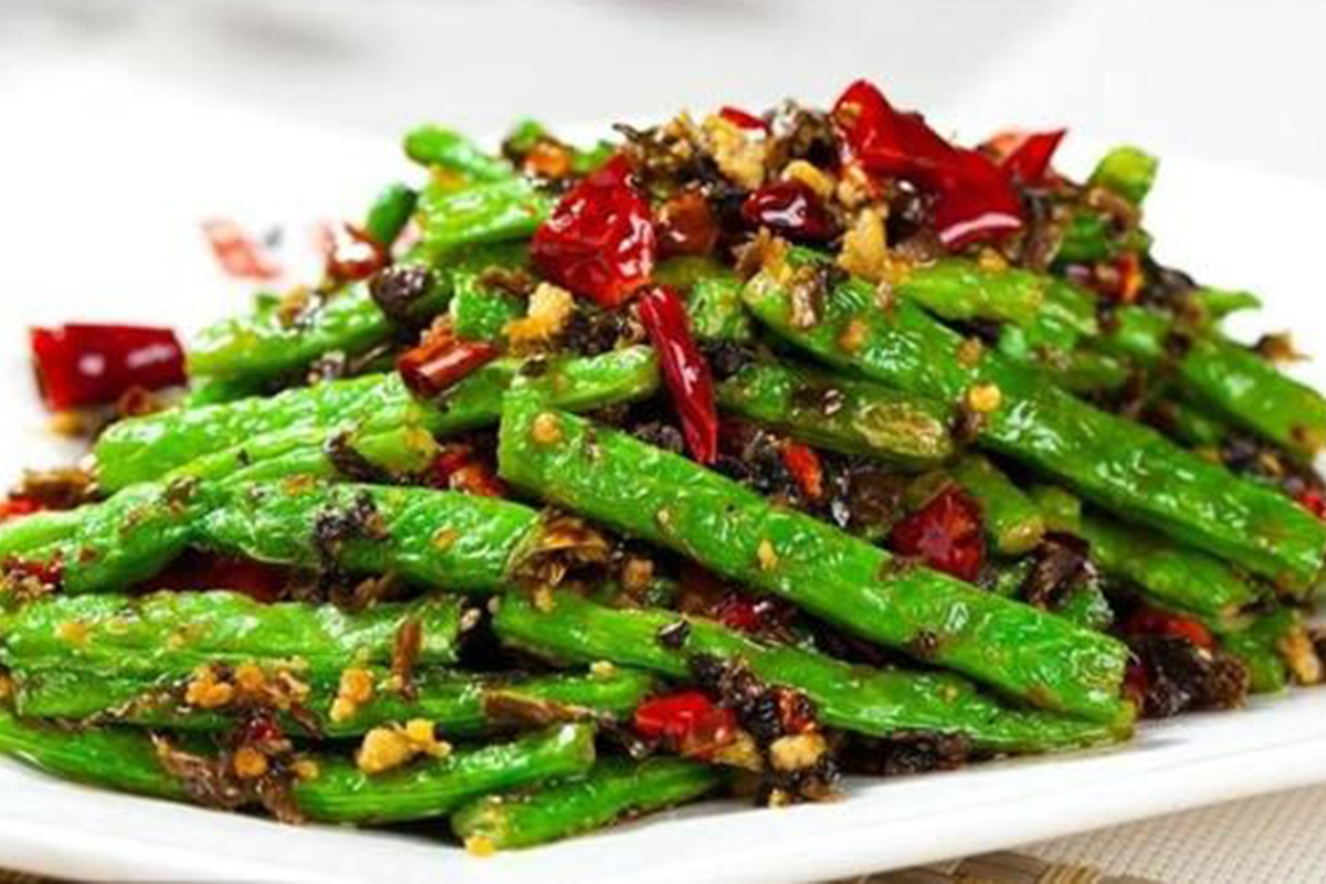 Dry - fried string beans with minced pork, dried chilies, and preserved vegetables at Hot Dumpling, a Chinese restaurant in Lake Forest