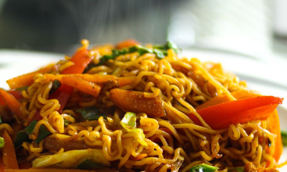 Stir-fried noodles with vegetables and meat in a savory sauce at Hot Point The Dalles, a Chinese restaurant in The Dalles