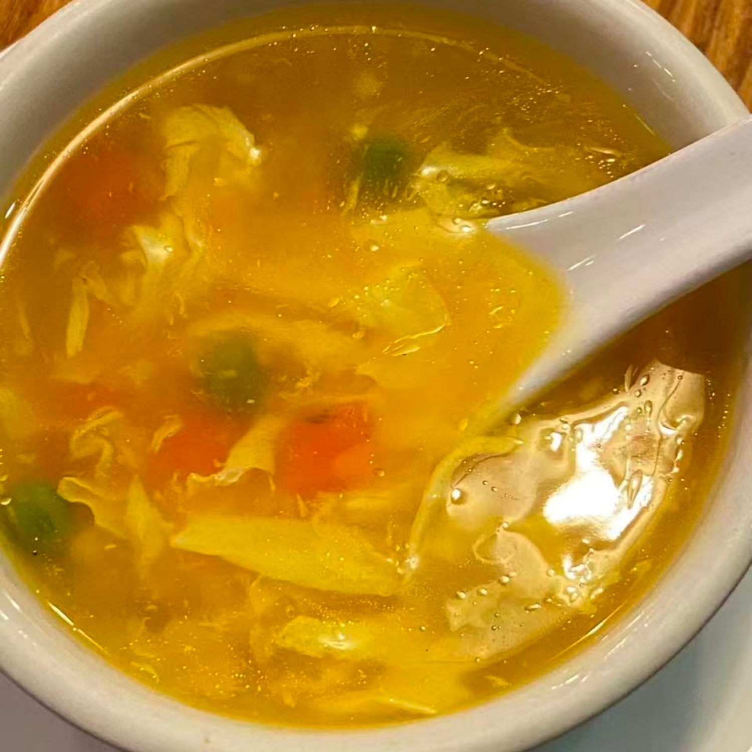 Egg drop soup with diced vegetables