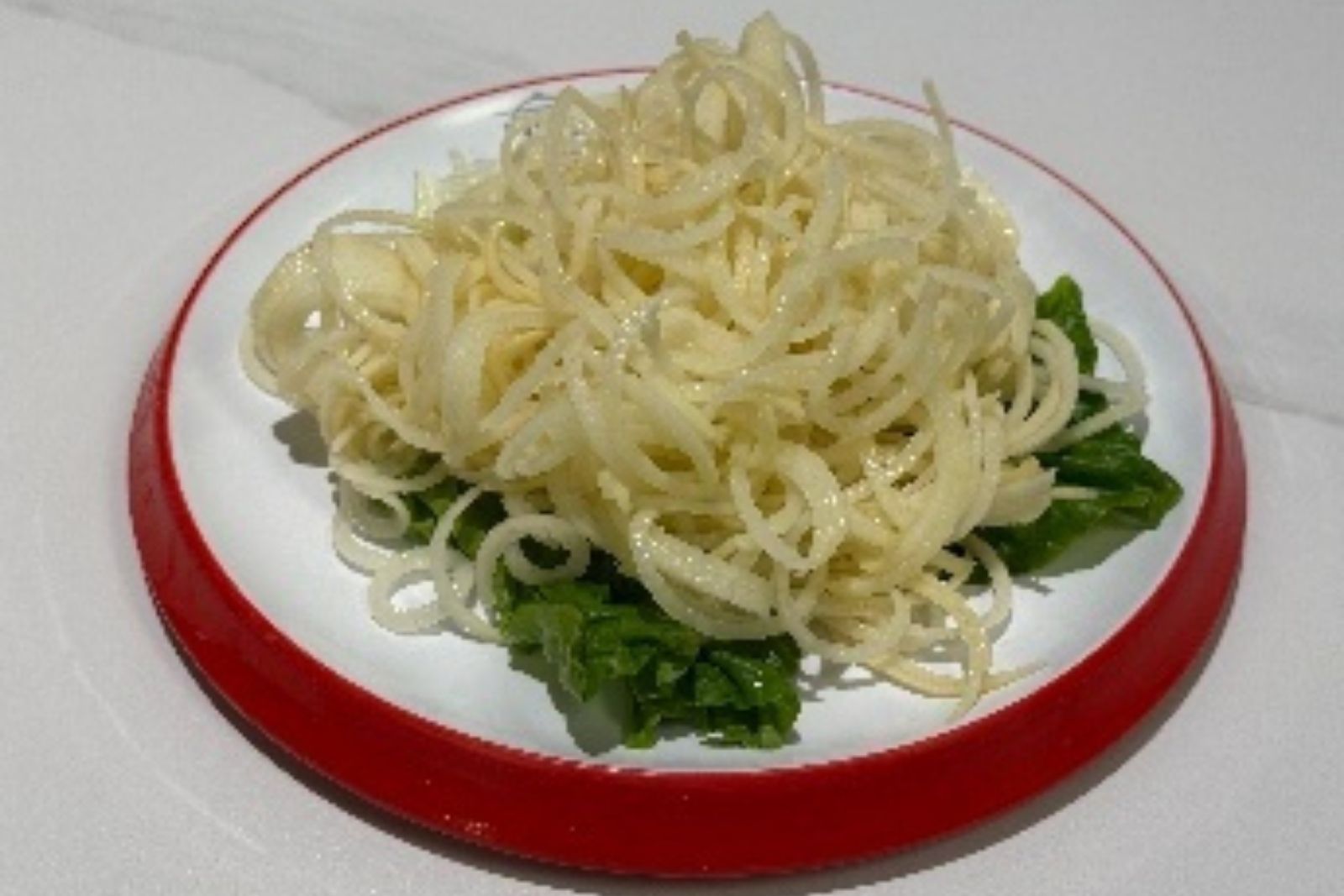 Shredded taro hot pot ingredient served with lettuce at Hotpot Bay, a Chinese Hot Pot Restaurant in San Francisco