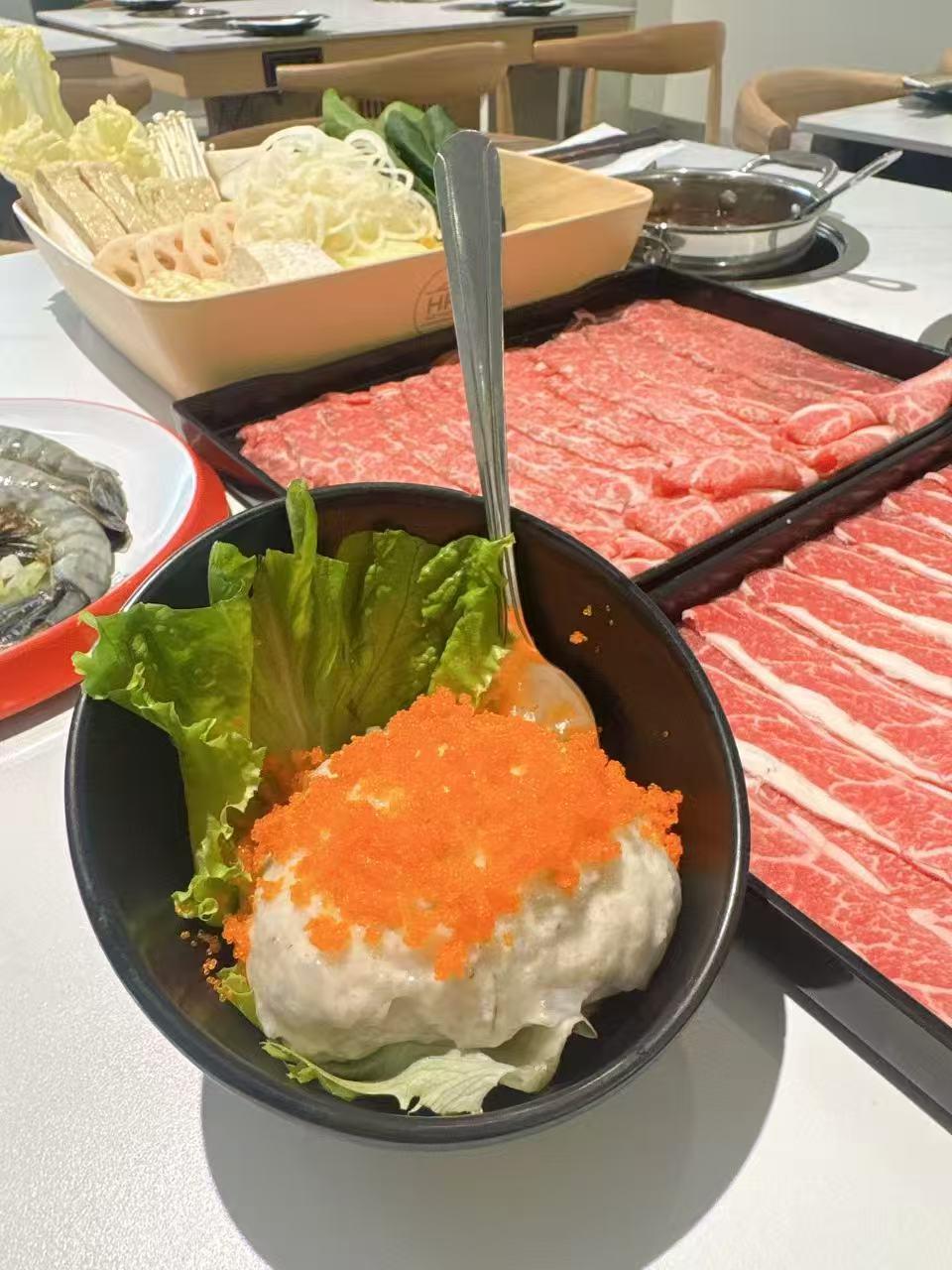 Surimi ball topped with tobiko hot pot ingredient at Hotpot Bay, a Chinese Hot Pot Restaurant in San Francisco