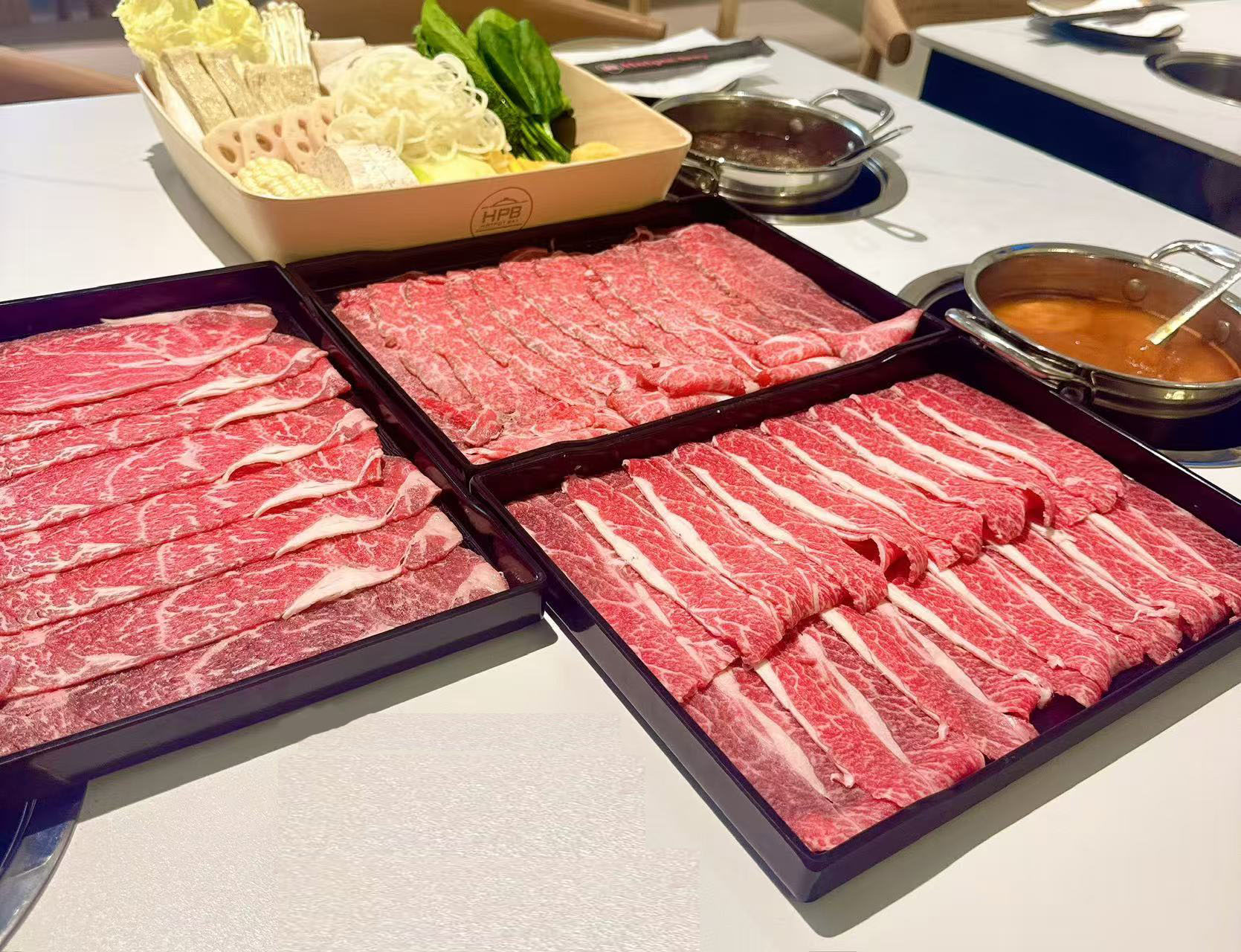 Premium beef & veggie hot pot set with dual broths at Hotpot Bay, a Chinese Hot Pot Restaurant in San Francisco