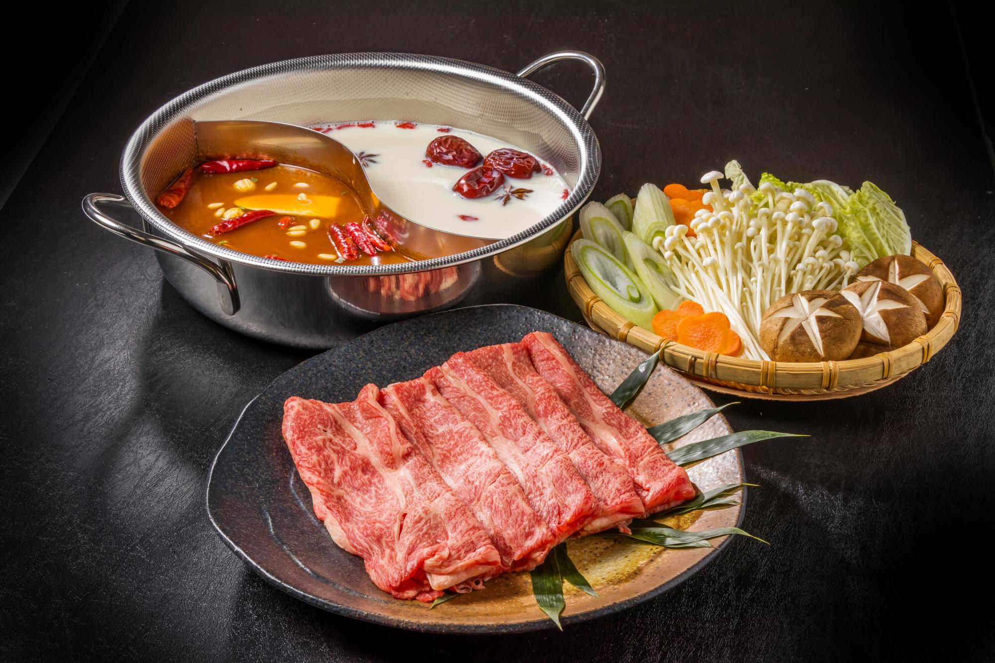 Dual Broth Hot Pot Set - Spicy and mild broths with beef and veggies at Hot Pot Delight, a Hot Pot Restaurant in Roselle