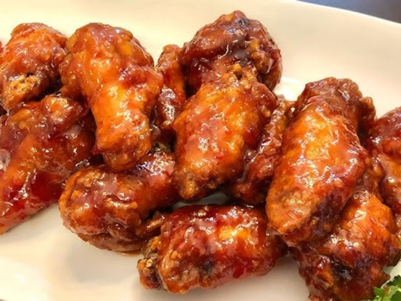 Hot-Spots-Eat-Fresh-Chinese-Restaurant-BBQ-Chicken-Wings-Denton BBQ chicken wings with glossy sauce, savory and appetizing at Hot Spots Eat Fresh, a Chinese Restaurant in Denton